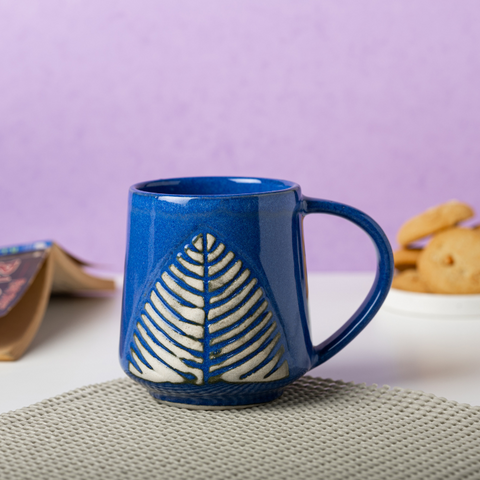 Thumbnail preview #0 for Blue Ceramic Coffee Mug with White Leaf Design